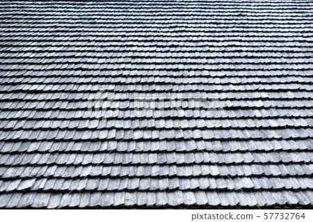 Old roof made of gray wooden planks. Backgrounds Old roof made of gray wooden planks. Backgrounds 57732764