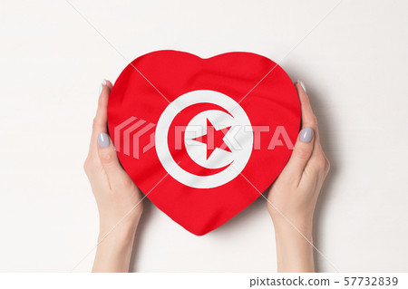 Flag of Tunisia on a heart shaped box in a female 57732839