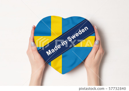 Inscription Made in Sweden the flag of Sweden. Inscription Made in Sweden the flag of Sweden. 57732840