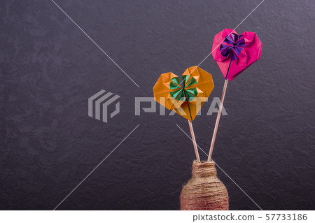 Concept of love handmade papercraft origami crafted colored paper hearts close-up shot in studio Concept of love handmade papercraft origami crafted colored paper hearts close-up shot in studio 57733186