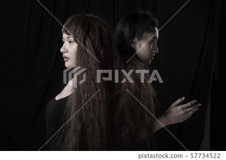 Twin Sisters on the same head and brown curl hair 57734522