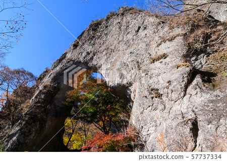 The first stone gate and autumn leaves of Mt. Myogi 57737334