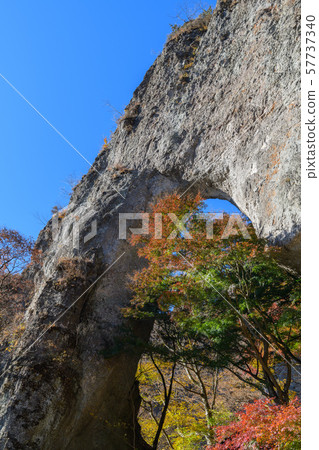 The first stone gate of Mt. Myogi and autumn leaves of Japanese maple 57737340