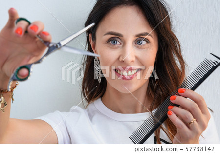 Professional hairdresser girl with comb and 57738142