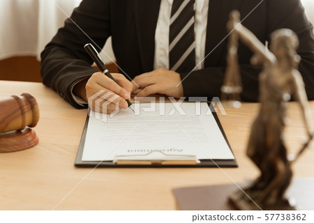lawyer signing legal document 57738362
