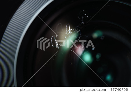 Close up dust and peel on a camera lens  57740706