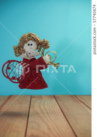 Beautiful Christmas bauble angel toy on a  and 57740874