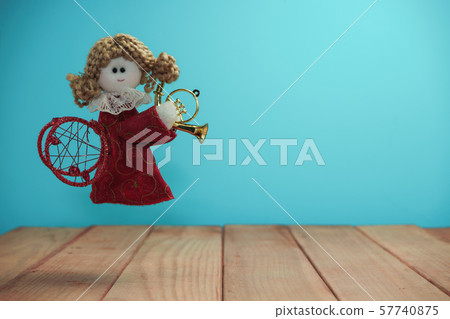 Beautiful Christmas bauble angel toy on a  and 57740875