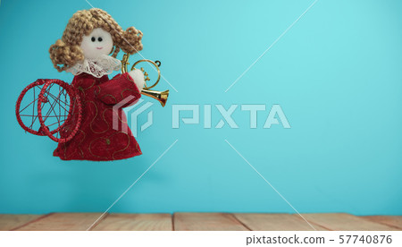 Beautiful Christmas bauble angel toy on a  and 57740876