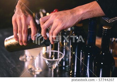 Closeup bartender hand preparing fresh juice 57744207