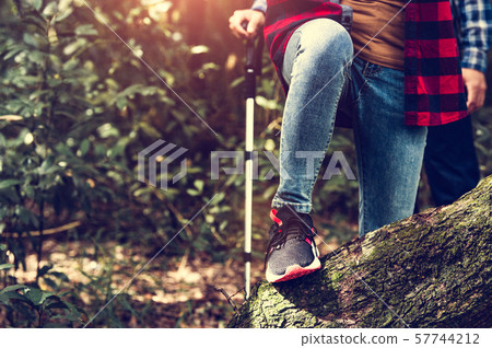 Closeup of female traveler legs and team group Closeup of female traveler legs and team group 57744212