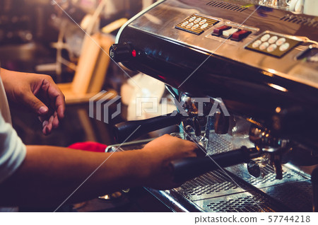 Closeup of professional male barista hand making Closeup of professional male barista hand making 57744218