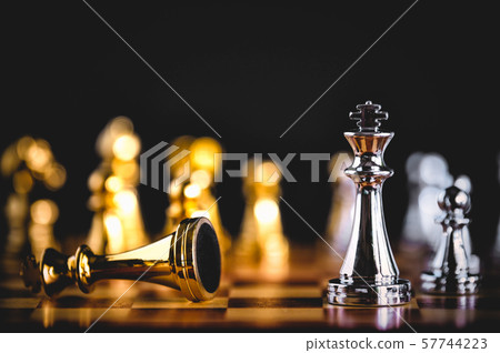 Closeup king chess piece defeated enemy or trade Closeup king chess piece defeated enemy or trade 57744223