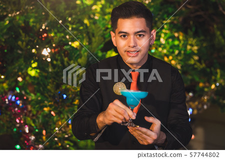 Professional bartender preparing fresh blue juice 57744802
