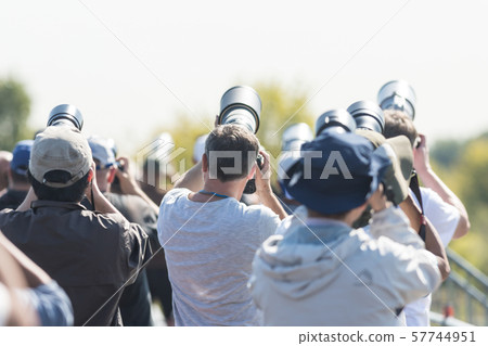 Photographers taking a shot of the airplanes 57744951
