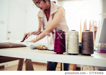 Closeup of colorful thread with fashion designer 57745068
