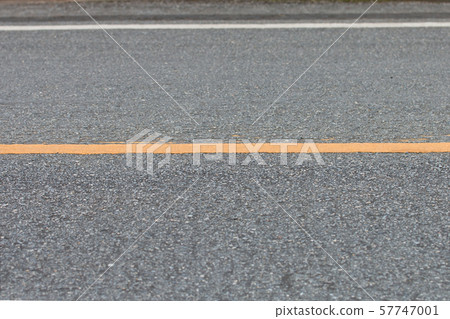 Asphalt road, yellow line on the road. 57747001