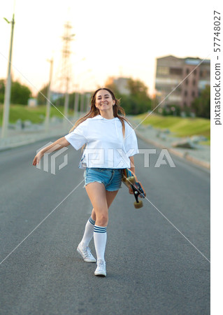 Street portrait of a girl in casual clothes and Street portrait of a girl in casual clothes and 57748027
