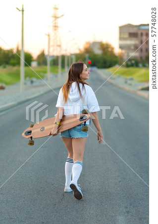 Beautiful sexy young girl in short shorts walking Beautiful sexy young girl in short shorts walking 57748028