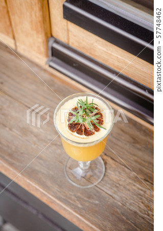 Fall hot punch cocktail on wooden table 57748462