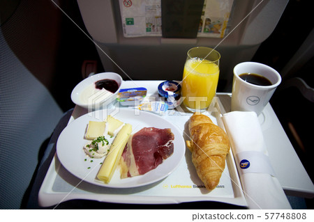 FRANKFURT, GERMANY - JAN 21st, 2017: breakfast on an airplane in Lufthansa Business Class with fresh 57748808