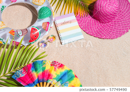 Colourful writing note pad with pink and green pen 57749490