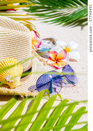 Beige straw hat with blue sunglasses Beige straw hat with blue sunglasses 57749491