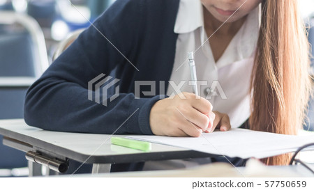 Blur school background university students writing answer doing exam in classroom .. Blur school background university students writing answer doing exam in classroom .. 57750659
