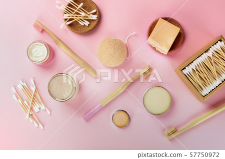 Plastic-free, zero waste cosmetics, flat lay pattern on a pink background, top shot. Bamboo 57750972