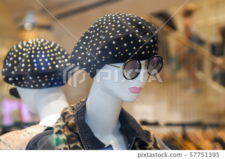Mannequin in beret and glasses in a shop 57751395