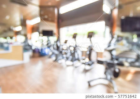 Blur gym background fitness center or health club with blurry sports exercise equipment for aerobic workout and bodybuilding Blur gym background fitness center or health club with blurry sports exercise equipment for aerobic workout and bodybuilding 57751642