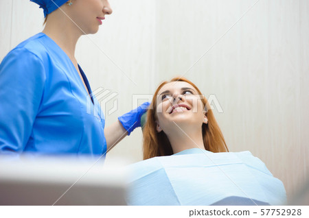 woman having medical checkup in the dentist office by the doctor 57752928