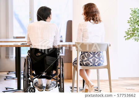 Wheelchair business 2 people Wheelchair business 2 people 57753662