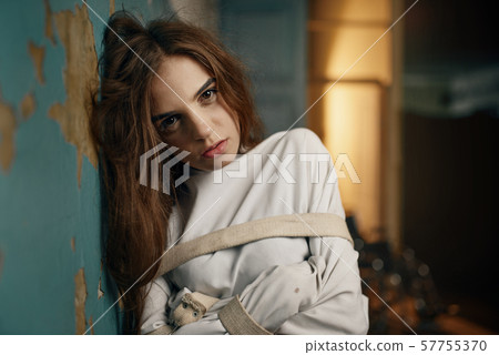 Female patient in strait jacket, mental hospital Female patient in strait jacket, mental hospital 57755370