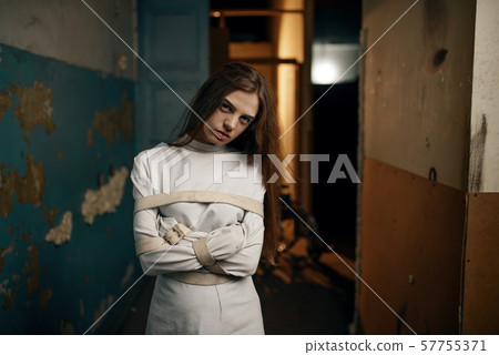 Female patient in strait jacket, mental hospital 57755371