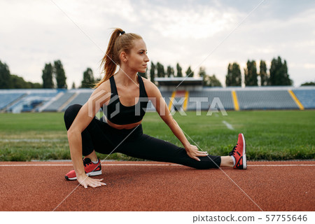 Female runner in sportswear, workout on stadium Female runner in sportswear, workout on stadium 57755646