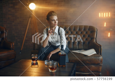 Woman at the table with whiskey, gangster style 57756199