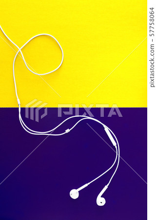 white headphones on a yellow-violet background. white headphones on a yellow-violet background. 57758064