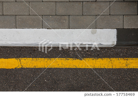 Yellow line of road marking along the pavement Yellow line of road marking along the pavement 57758469