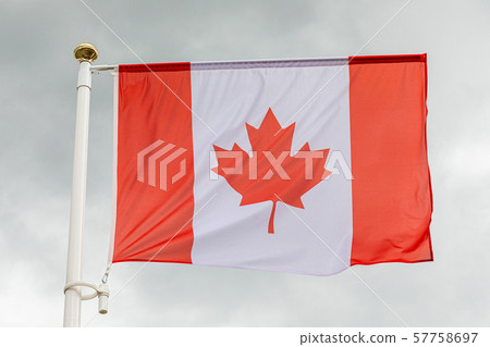 Canadian flag in the sky with white clouds Canadian flag in the sky with white clouds 57758697