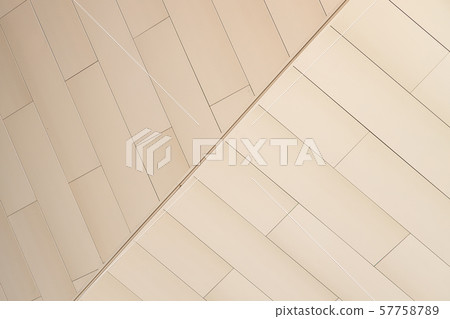 Angular view of beige color tiled wall of refracted relief Angular view of beige color tiled wall of refracted relief 57758789