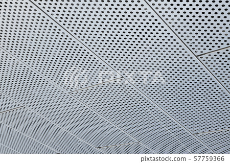 Metal grilles with many round holes in the ceiling Metal grilles with many round holes in the ceiling 57759366
