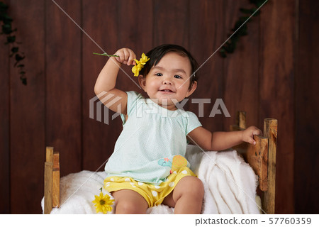 Playful small girl Playful small girl 57760359