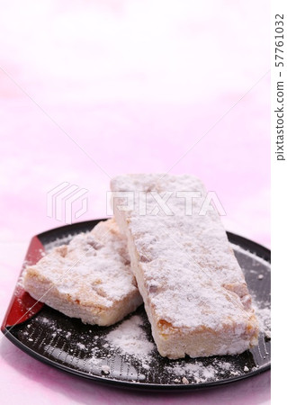Walnut cookies black plate Japanese paper background Walnut cookies black plate Japanese paper background 57761032