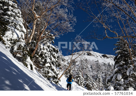Climbers heading to Yatsugatake mountain range and Iodake in winter Climbers heading to Yatsugatake mountain range and Iodake in winter 57761034