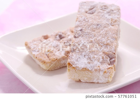 Walnut cookies white plate Japanese paper background Walnut cookies white plate Japanese paper background 57761051