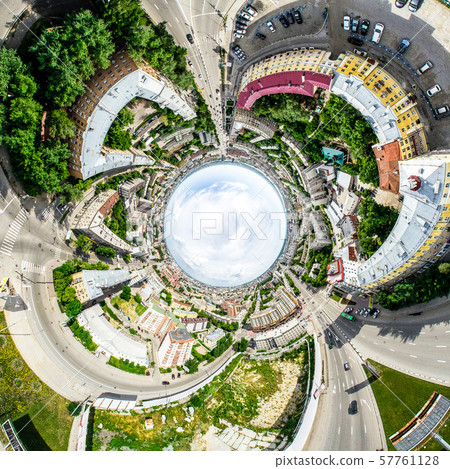 Aerial city view with crossroads and roads, houses, buildings, parks and parking lots. Sunny summer Aerial city view with crossroads and roads, houses, buildings, parks and parking lots. Sunny summer 57761128