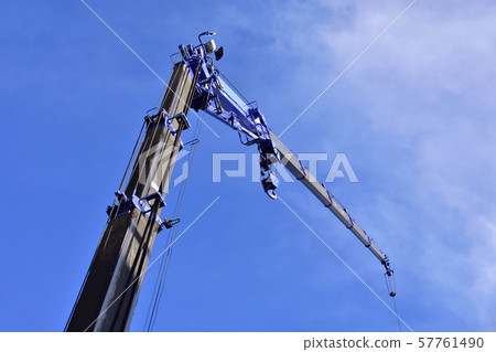 A rough terrain crane operating with the extension jib extended 57761490