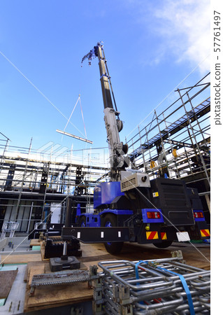 Rough terrain crane in operation with outriggers deployed Rough terrain crane in operation with outriggers deployed 57761497