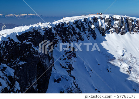 View of Yatsugatake mountain range and Iodake crater wall and Central Alps 57763175